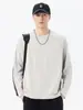 Camiseta de manga larga con cuello redondo para hombre, nuevo estilo primavera/otoño 2026, diseño retro japonés de moda, color liso, diseño estructurado con detalles de patchwork