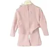Nuevo conjunto de sudadera de primavera y otoño para niñas, con una chaqueta corta con cremallera estilo coreano y pantalones acampanados, un atuendo de dos piezas para niñas pequeñas