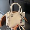 Bolso de Cubo Portátil de Estilo Occidental Moderno y Simple para Mujer 2025 Primavera Nuevo de Alta Gama Versátil Bolso de Hombro Cruzado Moderno