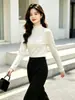 Camiseta base de punto de dos piezas con núcleo de lana hilada, estilo dulce, cuello alto simple con volantes, suéter grueso nuevo de otoño e invierno para mujer