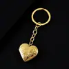 Llavero de metal con forma de corazón y diseño de plantas transfronterizo, espejo con acabado espejo para bricolaje, puede contener fotos, llavero de acero inoxidable