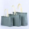 En stock Bolsa de Tela No Tejida Gruesa Popular en Internet Larga Portátil Hombro Simple Tienda de Ropa Bolsa de Compras LOGO Personalizado