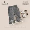 Calça de Primavera para Meninas 2026 Nova Moda Calça Longa Xadrez para Bebês e Crianças Pequenas Estilo Coreano Calça Casual de Primavera e Outono para Crianças