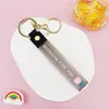 Llavero Colgante de Cordón de Cuero con Letra Transparente Brillante con Accesorios Estilo Muñeca Rellena de Aceite Encanto de Llavero Pulsera Venta al por Mayor