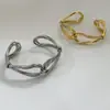 Pulsera abierta de múltiples hilos retorcidos, de moda europea y americana, para mujer, diseño de nicho de lujo ligero, estilo metálico, exquisita y versátil para el uso diario
