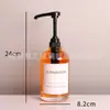 Botella de vidrio para desinfectante de manos al por mayor botella de loción negra con cabezal de bomba de presión larga botella dispensadora de jabón transfronteriza
