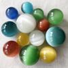 Venta al por mayor de fábrica de adornos coloridos de ojo de gato, adornos para sala de estar, juego de balonmano, piedra de ojo de gato, bola de cristal, bola de Feng Shui
