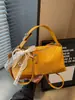 Nuevo bolso tejido de alta costura transfronterizo 2026, diseño elegante, bolso tote pequeño para salir, bolso de hombro y cruzado para mujer