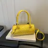 Moda Nova Outono 2026 Bolinha Design Simples de Nicho Tendência Versátil Bolsa Cilindro de Ombro Cruzado de Mão