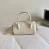 Bolso tipo Baguette de Textura Minimalista de Alta Gama para Mujer, Nuevo Estilo Coreano 2026 Bolso de Mano Versátil con Diseño Único, Bolso de Hombro