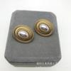 Pendientes de moda retro europeos y americanos de aleación chapada en oro, pendientes vintage de la serie Perla sin agujeros para las orejas para mujer.
