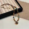 Collar de Piedra Ojo de Tigre en Forma de Corazón Color Café Maillard para Mujer Modelo Nuevo 2026 Cadena para Suéter de Lujo de Gama Alta