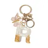 Llavero Colgante de Borla con Letra Inglesa Personalizada de Purpurina Blanca con Resina Epoxi y Colgante de Resina con Pan de Oro, Llavero Sencillo