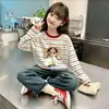 Camiseta de manga larga a rayas de algodón puro para niña, nuevo estilo primavera y otoño 2026, holgada y elegante, camiseta básica versátil para niños