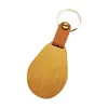 Hebilla de cuero Colgante de llavero de bambú Moderno Simple Colgante de llavero de madera en blanco Letrero con logotipo personalizado de cuero