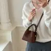 Bolso de mano para mujer para salir, nuevo bolso de hombro de gamuza vintage 2026, bolso cruzado tipo cubo versátil de nicho para el día a día