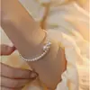 Pulsera de perlas retro francesas para mujer, ligera, de lujo, elegante, de alta gama, con diseño de nicho, sencilla y combinable.