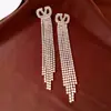 Brincos de Tarraxa Simples com Borla Oca Oval Inlaid de Diamante Agulha de Prata Leve Luxo Sensação de Alto Padrão Brincos Modernos Europeus Americanos Ornamentos Individuais para Orelha