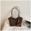 Bolsa Feminina Grande Capacidade Elegante para o Dia a Dia 2026 Outono Inicial Nova Bolsa de Ombro Único Bolsa Tote de Mão Tendência de Alto Estilo