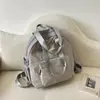 Mochila simples de cor sólida inspirada no estilo ins coreano, novo modelo da primavera de 2026, bolsa de mão/ombro para estudantes universitários para as aulas