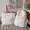 Mochila de estilo coreano con estampado de estrellas: ligera, versátil, moderna, adecuada para estudiantes de secundaria y preparatoria, con gran capacidad y se puede llevar como bolso de hombro o bolso de mano