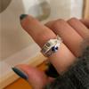 Anillo de lujo abierto con diseño irregular de lava y circonita negra en plata esterlina s925 de Corea Dongdaemun, con patrón de papel de hojalata.