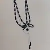 Collar de cuentas con lazo oscuro multicapa retro para mujer, cadena para clavícula de moda niche