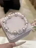 Pulsera Corona Saturno Bicolor Degradada de Perlas y Pedrería Swarovski para Mujer, con un Diseño Único y Elegante