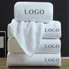Toallas de hotel cinco estrellas toallas de baño casa de huéspedes B&B algodón engrosado alta calidad salón de belleza bordado especial LOGO toallas faciales