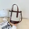 Bolso cubeta de colores contrastantes popular de este año para mujer 2026 nuevo bolso de mano de moda nicho bolso de hombro sensación de alta gama bolso cruzado
