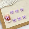 Mini accesorios para uñas de lazo al por mayor tamaño pequeño tridimensional combinan con todo lazo de cinta resina accesorios para uñas DIY
