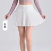 Ropa de yoga para mujer: una falda plisada elegante, de alta gama y única con una abertura, diseñada para evitar la exposición, crear una silueta acampanada que estiliza y contar con prácticos bolsillos interiores