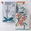 Flor de toalla Zhiyang gasa creativa toalla para niños toalla pequeña para la cara de bebé regalo de mano para banquete de luna llena toalla para niños al por mayor