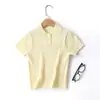 Novedad Primavera y Verano Ropa de Punto para Niños Lyocell Cuello Polo Torcido Manga Corta Color Sólido Camisa de Punto para Niños y Niñas