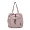 Bolsa tote de nylon com cordão e múltiplos bolsos, grande capacidade, adequada para o trajeto diário, leve, casual, para estudantes, e pode ser carregada na mão.