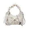 Bolso texturizado de diseño Yuezizi para mujer 2026 Nueva moda de verano Bolso de hombro simple para el día a día, Bolso de axila, Bolso cruzado