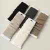 Calcetines de dama otoño e invierno nuevos calcetines de tubo largo vertical para mujer calcetines de felpa para pie y pierna color liso calcetines Joker venta al por mayor Zhuji