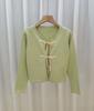 Jaqueta Cardigan de Tricô com Laço para Mulheres Outono e Inverno 2025 Novo Design Nicho Cadarço Caimento Solto Emagrecedor Top