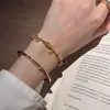 Pulsera de Hilo de Dinero de Venta Caliente de Xiaohongshu con Abalorios de Ojo de Gato Cepillado Dorados Brillantes, Versátil y Elegante, Disponible para Dropshipping