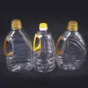 Varios Especificaciones de Barriles Transparentes Comestibles de Aceite para Mascotas Fabricante Mayorista 1.8L Sellado Plástico Barriles de Aceite de Cacahuete Barriles Vacíos Personalizados