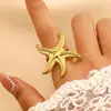 Anel de Aço Inoxidável Estrela do Mar Dourada Europeu e Americano Anel Aberto de Aço Titânio Nicho Joia de Alto Padrão Estilo Oceano Feminino