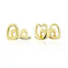 Europa y Estados Unidos superventas doble circonita hueco doble tirantes hip-hop todo-partido diario callejero fresco diamante dientes de oro accesorios