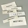 Los fabricantes ropa accesorios marca de lavado impresión flexográfica marca comercial monocromática cinta de borde etiqueta de cuello no es fácil de decolorar lavado marca tejida