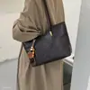Bolsa de ombro única de grande capacidade, simples e estilosa, nova de inverno de 2026, tote versátil coreana para o dia a dia da mulher