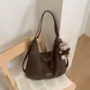 Bolso tote retro popular de temporada cruzada bolso de axila nuevo estilo moda Otoño 2026 bolso de hombro sensación de alta gama mochila