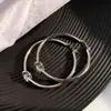 Pendientes de aro grandes redondos lisos anudados de plata europeos y americanos para mujer, arete de temperamento exagerado, diseño de nicho, sensación de alta calidad, pendientes de oro nuevos