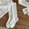Novas meias de cano alto de cor sólida com padrão de losangos estilo coreano para outono e inverno, meias longas versáteis que afinam a perna, meias longas estilo coreano com camadas