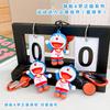 Llavero auténtico de la serie Doraemon Sports Expert, muñeco de gato Jingdang, colgante para bolso de pareja, suministro de regalo
