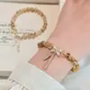 Pulsera de Hilo Elástico con Borla y Lazo de Cristal Amarillo Natural para Mujer, Exquisita, Dulce, de Nicho, Estilo Lujo Ligero