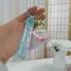 Llavero de Botella de Arena Líquida de Dibujos Animados, Pequeños Regalos para Puestos, Accesorios Acrílicos al por Mayor, Colgante Relleno de Aceite, Rasca Gatos Lindo de Regalo